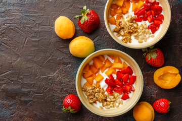 Homemade yogurt with granola, apricot and pine nuts