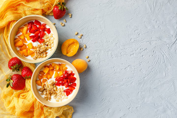 Homemade yogurt with granola, apricot and pine nuts
