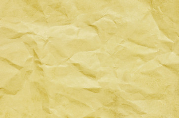 Yellow ancient grunge crumpled paper pattern texture.