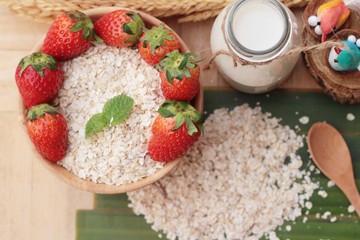 Oatmeal with milk and fresh strawberry for health