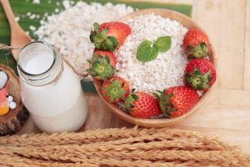 Oatmeal with milk and fresh strawberry for health