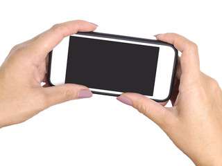 Woman two hands holding mobile phone and taking picture, isolated on white.