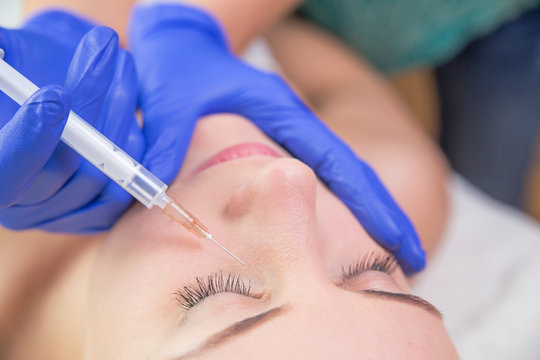 Beautiful Young Woman Gets Beauty Injection In Eye Area