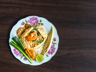 Fried Noodles wrapped with eggs Phad Thai