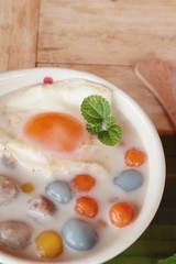 Colorful dumplings in coconut milk and egg
