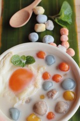 Colorful dumplings in coconut milk and egg