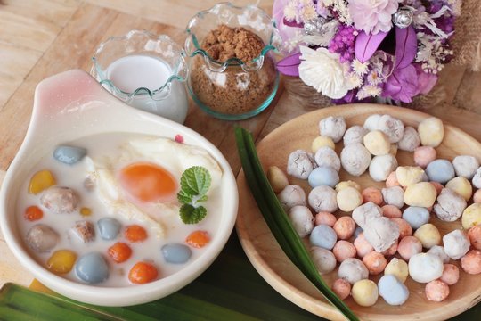 Colorful dumplings in coconut milk and egg