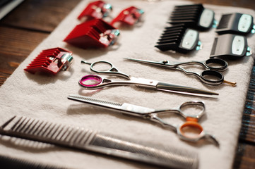 hairdressing tools on a towel - scissors, combs, clipper