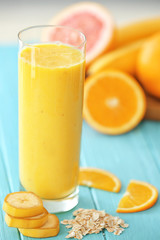 Glass with fresh tasty smoothie on table