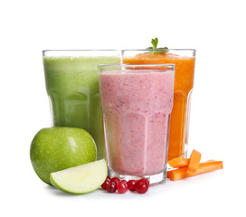 Glasses with fresh tasty smoothies on white background