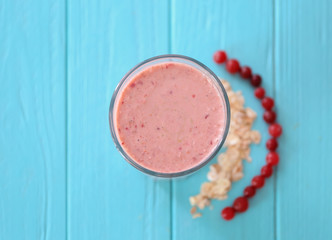 Glass with fresh tasty smoothie on table