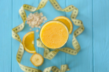 Glass with fresh tasty smoothie on table