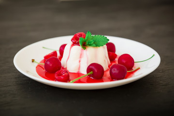 Delicious jelly Panna cotta with cherry berries, traditional Italian dessert
