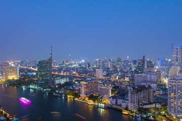 Fototapeta na wymiar Bangkok city skyline at dusk with Chao Phraya river view.
