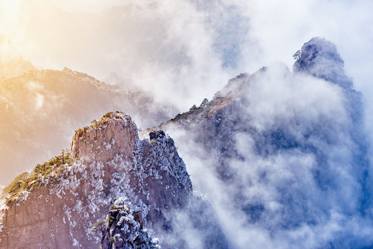 Sunrise above colorful peaks.