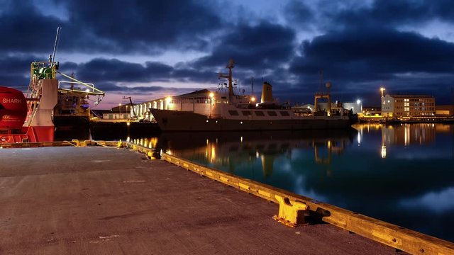 Timelapse looking over Reykjavik harbour during blue hour on a calm summer night