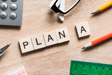 Conceptual business keywords on table with elements of game making crossword