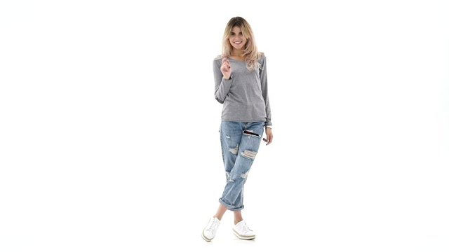Young smiling caucasian lady pointing at you isolated over white background