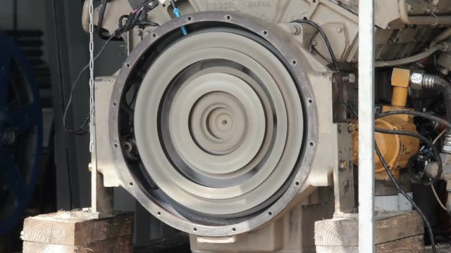 engine starting. Test start of a diesel engine. Trial run of a diesel engine. flywheel turns. flywheel begins turns