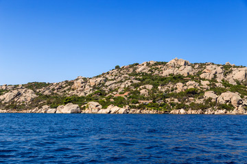 Fototapeta premium Sardinia, Italy. Rocky beach and villas
