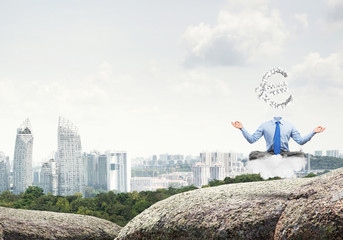 Obraz premium Headless meditating businessman