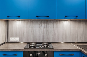 Modern kitchen. Gas cooker and extractor