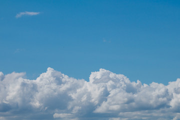 Naklejka na ściany i meble Beautiful large fluffy clouds in the sky
