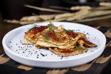 Pancakes with salmon caviar