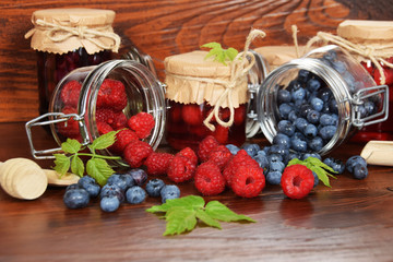 blueberries and raspberries in jars for the winter tea