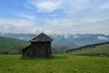 Obraz premium Warehouse for hay, against the background of rainy sky. 