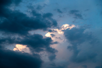 Naklejka na ściany i meble Clouds at sunset as background