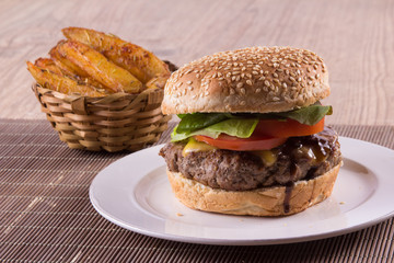 Burger with cheese, onions and salad