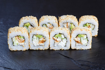 Delicious california sushi rolls with smoked eel and cream cheese. Tasty Japanese food