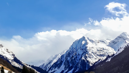 Fototapeta na wymiar Snow-covered mountaintops