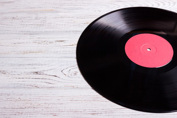 vinyl disc isolated on the wooden table