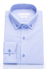 Man's shirt blue on a white background. Vertical