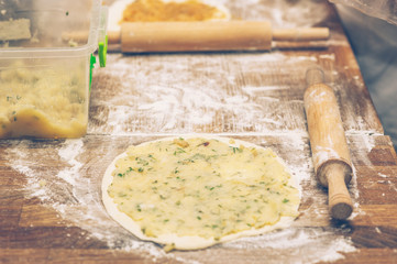Making pastries from dough with stuffing. 
