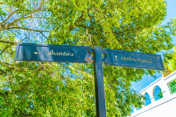 Granada, Spain, juli 1, 2017: street sign to Alhambra and centre of the town of Granada