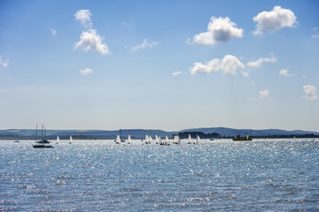 Sandbanks boats under sunshine and blue skies