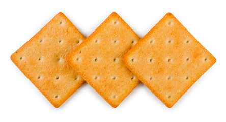 Three of crispy salted crackers isolated on a white background, top view, close up.