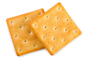 Pair of crispy salted crackers isolated on a white background, top view, close up.
