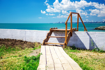 Fototapeta premium Wooden stairway to beautiful tropical beach. landscape