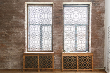 Arabic style room. Two windows with beautiful carving