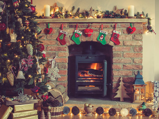 Christmas setting, decorated fireplace, fur tree