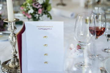 Dinner table wine glas candle burning card Event German header text hochzeitsmenu translation Wedding menu Copyspace