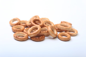 Salty Mini Pretzels with Salt in a Bowl, small bagel - homemade organic snack for beer isolated white background