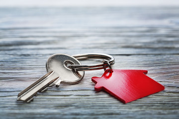 Real estate concept, Key ring and keys on wooden background