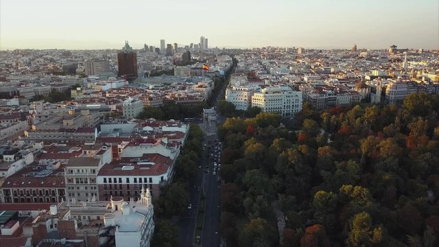 Fly over the evening Madrid with a view of the house and the road