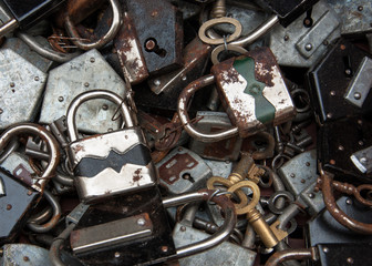 Old rusty locks and keys at flea market. Security, censorship or suppression concept.