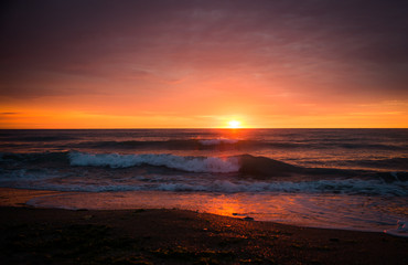 Fototapeta na wymiar Dramatic sunset over the sea